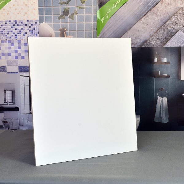 Sleek square white tile with a smooth finish displayed in a modern showroom by Aurees Tiles, suitable for bathroom floor tiles and bathroom wall tiles 